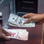 تبادل عملات نقدية عند شباك الصرف، وظيفة أمين صندوق في مونتريال